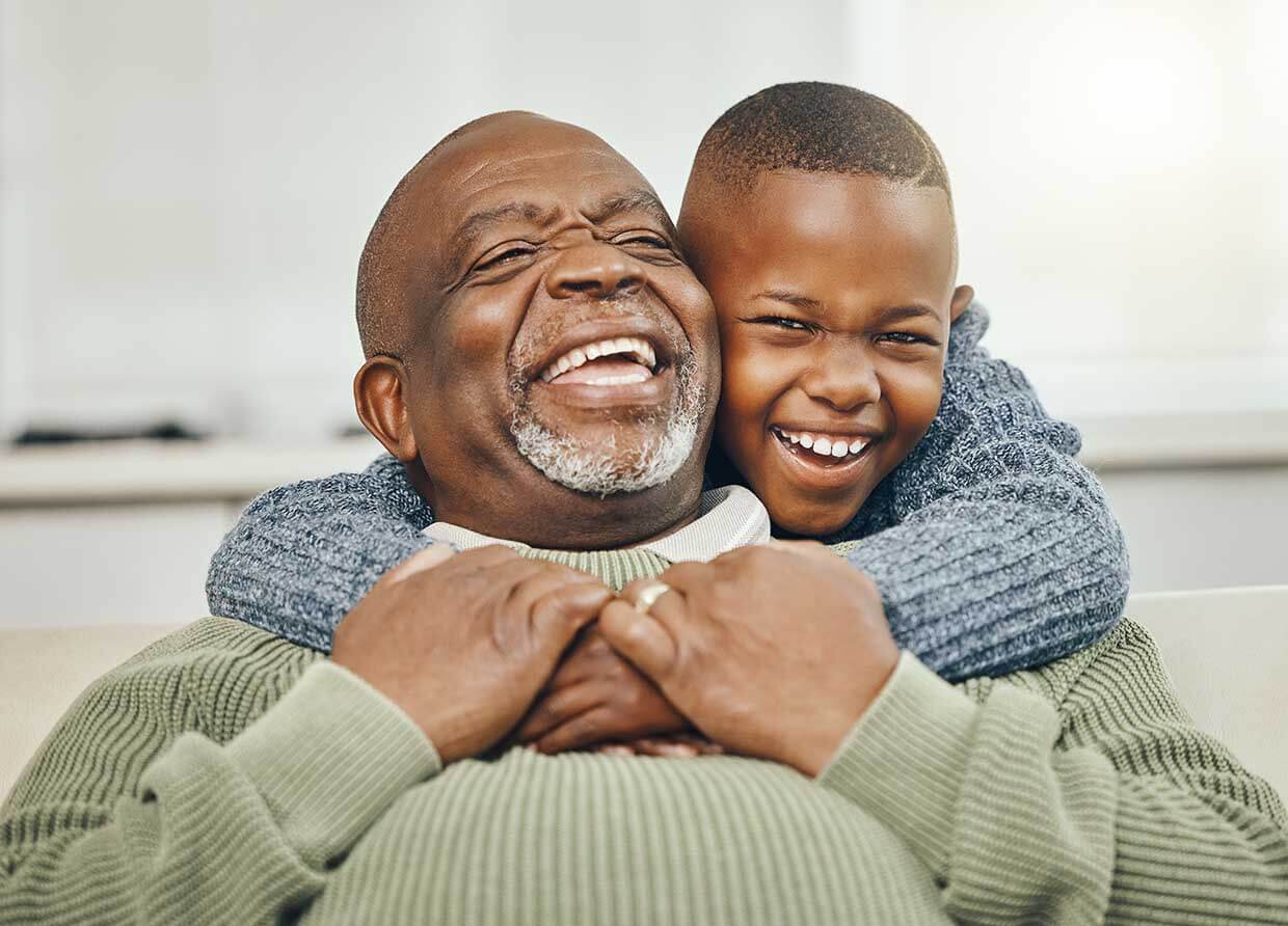 Grandparent with grandchild &mdash; protecting family legacy with estate planning